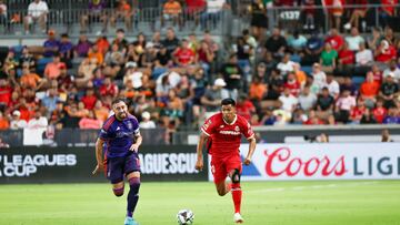Aug 9, 2024; Houston, Texas, USA; Houston Dynamo midfielder Hector Herrera (16) chases Toluca midfielder Jesus Gallardo (20) in the first half at Shell Energy Stadium. Mandatory Credit: Thomas Shea-USA TODAY Sports
