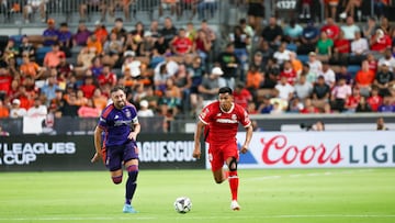 Aug 9, 2024; Houston, Texas, USA; Houston Dynamo midfielder Hector Herrera (16) chases Toluca midfielder Jesus Gallardo (20) in the first half at Shell Energy Stadium. Mandatory Credit: Thomas Shea-USA TODAY Sports