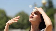 Asian woman drying sweat in a warm summer day