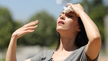 Asian woman drying sweat in a warm summer day