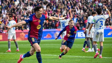 Barcelona's Polish forward #09 Robert Lewandowski (L) celebrates after scoring their first goal during the Spanish league football match between FC Barcelona and Deportivo Alaves at the Estadi Olimpic Lluis Companys in Barcelona on February 2, 2025. (Photo by Josep LAGO / AFP)