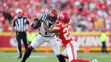 KANSAS CITY, MISSOURI - SEPTEMBER 15: Trent McDuffie #22 of the Kansas City Chiefs tackles Ja'Marr Chase #1 of the Cincinnati Bengals during the fourth quarter at GEHA Field at Arrowhead Stadium on September 15, 2024 in Kansas City, Missouri. David Eulitt/Getty Images/AFP (Photo by David Eulitt / GETTY IMAGES NORTH AMERICA / Getty Images via AFP)