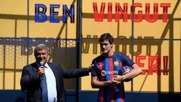 Barcelona's Spanish President Joan Laporta (L) speaks next to FC Barcelona's Spanish defenders Marcos Alonso during his official presentation in Barcelona on September 6, 2022, on the eve of their UEFA Champions League, group C, first leg football match between FC Barcelona and FC Viktoria Plzen. (Photo by Josep LAGO / AFP)
