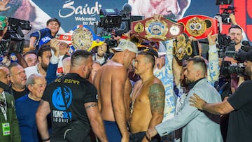 Britain's Tyson Fury (L) and Ukraine's Oleksandr Usyk (R) stare each other down during the official weigh-in on the eve of their heavyweight world boxing championship fight
in Riyadh on May 17, 2024. (Photo by Yasser al-UMARI / AFP)