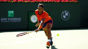 INDIAN WELLS, CALIFORNIA - MARCH 14: Rafael Nadal of Spain plays a backhand against Dan Evans of Great Britain in their third round match on Day 8 of the BNP Paribas Open at the Indian Wells Tennis Garden on March 14, 2022 in Indian Wells, California.   Clive Brunskill/Getty Images/AFP
 == FOR NEWSPAPERS, INTERNET, TELCOS &amp; TELEVISION USE ONLY ==