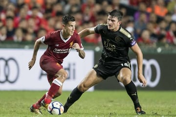 Liverpool FC midfielder Philippe Coutinho against Leicester City FC defender Harry Maguire during the Premier League Asia Trophy.