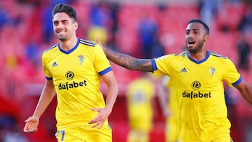 GRANADA, SPAIN - MAY 02: Ruben Sobrino of Cadiz CF celebrates with team mate Carlos Akapo (R) after scoring their side's first goal during the La Liga Santander match between Granada CF and Cadiz CF at Estadio Nuevo Los Carmenes on May 02, 2021 in Gr