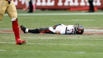 SANTA CLARA, CALIFORNIA - DECEMBER 11: Tom Brady #12 of the Tampa Bay Buccaneers reacts as he lies on the ground during an NFL football game between the San Francisco 49ers and the Tampa Bay Buccaneers at Levi's Stadium on December 11, 2022 in Santa Clara, California. (Photo by Michael Owens/Getty Images)