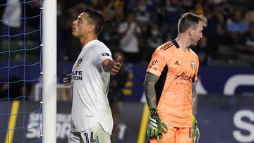 LA Galaxy forward Javier Hernandez (14) celebrates his goal next to Portland Timbers goalkeeper Steve Clark during the second half of an MLS soccer match Saturday, Oct. 16, 2021, in Carson, Calif. (AP Photo/Marcio Jose Sanchez)