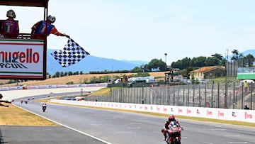 MotoGP - Italian Grand Prix - Mugello Circuit, Scarperia e San Piero, Italy - June 22, 2025 Liqui Moly Dynavolt Intact GP's Manuel Gonzalez passes the chequered flag to win the moto 2 race REUTERS/Jennifer Lorenzini