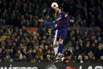 Lionel Messi headers the ball against Espanyol on Thursday night.