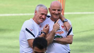 France's coach Didier Deschamps (L) jokes with France's assistant coach Guy Stephan during a training session at the Nandor Hidegkuti stadium in Budapest on June 24, 2021 as part of the UEFA EURO 2020 football competition. (Photo by FRANCK FIFE