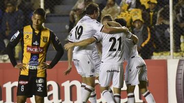 Argentina Lanus' NicolxE1s Pasquini (C) celebrates after scoring against Bolivia's The Strongest, during their Copa Libertadores match at Hernando Siles Stadium in La Paz, on July 06, 2017 / AFP PHOTO / ar / AIZAR RALDES