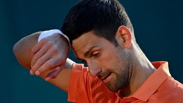 Serbia's Novak Djokovic wipes his forehead against Serbia's Laslo Djere during their tennis single match at Serbia Tennis Open ATP 250 series tournament in Belgrade on April 20, 2022. (Photo by ANDREJ ISAKOVIC / AFP)