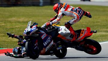 FILE PHOTO: MotoGP - Repsol Honda Team's Marc Marquez and CryptoDATA RNF MotoGP Team's Miguel Oliveira after crashing during the Portuguese Grand Prix - Algarve International Circuit, Portimao, Portugal - March 26, 2023 REUTERS/Marcelo Del Pozo/File Photo