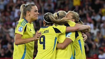Sweden's players celebrate after Sweden's defender #22 Smilla Holmberg scored her team's second goal during the UEFA Women's Euro 2025 Group C football match between Sweden and Germany at Letzigrund Stadium in Zurich, on July 12, 2025. (Photo by Miguel MEDINA / AFP)