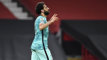 13 May 2021, United Kingdom, Manchester: Liverpool's Mohamed Salah celebrates scoring his side's fourth goal during the English Premier League soccer match between Manchester United and Liverpool at Old Trafford. Photo: Peter Powell/PA Wire/dpa