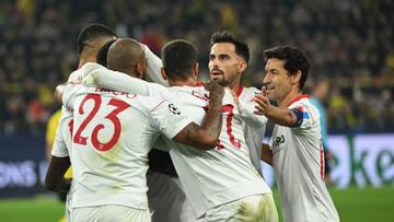 Sevilla's French defender Tanguy Nianzou (C-Hidden) celebrates scoring the opening goal with his team mates during the UEFA Champions League group G football match Borussia Dortmund vs Sevilla FC in Dortmund, western Germany, on October 11, 2022. (Photo by INA FASSBENDER / AFP) (Photo by INA FASSBENDER/AFP via Getty Images)