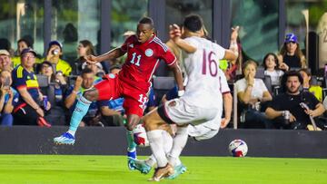 Colombia's midfielder #11 Andr�s G�mez and Venezuela's midfielder #16 Renne Rivas vie for the ball during the friendly football match between Colombia and Venezuela at the DRV PNK Stadium in Fort Lauderdale, Florida, December 10, 2023. (Photo by Chris Arjoon / AFP)