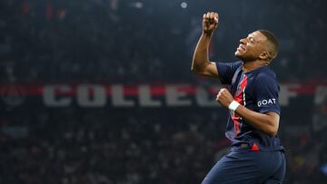 Paris Saint-Germain's French forward #07 Kylian Mbappe punches the air as he celebrates scoring Paris Saint-Germain's third goal during the French L1 football match between Paris Saint-Germain (PSG) and RC Lens at the Parc des Princes Stadium in Paris on August 26, 2023. (Photo by Alain JOCARD / AFP)