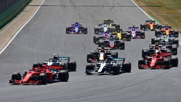 (FILES) In this file photo taken on July 8, 2018 Ferrari&#039;s German driver Sebastian Vettel leads at the first corner during the British Formula One Grand Prix at the Silverstone motor racing circuit in Silverstone, central England. - Renault&#039;s Executive Director Marcin Budkowski said there could be a rocky road ahead, again because of the changes to immigration rules. &quot;Potentially yes it could be a problem,&quot; he told AFP. &quot;We employ different nationalities... (Photo by Andrej ISAKOVIC / AFP)