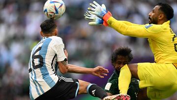 Saudi Arabia's goalkeeper #21 Mohammed Al-Owais (R) hits Saudi Arabia's defender #13 Yasser Al-Shahrani (C) in the head during the Qatar 2022 World Cup Group C football match between Argentina and Saudi Arabia at the Lusail Stadium in Lusail, north of Doha on November 22, 2022. (Photo by Kirill KUDRYAVTSEV / AFP)
