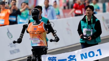 Tiangong Ultra, a humanoid robot, runs across the finish line while securing the first position during the E-Town Humanoid Robot Half Marathon, in Beijing, China, April 19, 2025. REUTERS/Tingshu Wang TPX IMAGES OF THE DAY