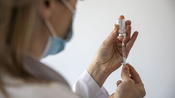 PRIZREN, KOSOVO - APRIL 09: A nurse prepares a dose of AstraZeneca vaccine at the COVAX vaccination center in the Main Family Health Care Center as the government begins the country&#039;s vaccination rollout for people aged over 85 with the AstraZeneca v