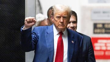 Former U.S. President Donald Trump walks at New York State Supreme Court in New York, U.S., 30 April 2024. Trump is facing 34 felony counts of falsifying business records related to payments made to adult film star Stormy Daniels during his 2016 presidential campaign.     JUSTIN LANE/Pool via REUTERS