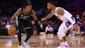 LOS ANGELES, CALIFORNIA - APRIL 22: Ja Morant #12 of the Memphis Grizzlies dribbles in front of D'Angelo Russell #1 of the Los Angeles Lakers during 111-101 Lakers win in Game Three of the Western Conference First Round Playoffs at Crypto.com Arena on April 22, 2023 in Los Angeles, California. NOTE TO USER: User expressly acknowledges and agrees that, by downloading and or using this photograph, User is consenting to the terms and conditions of the Getty Images License Agreement.   Harry How/Getty Images/AFP (Photo by Harry How / GETTY IMAGES NORTH AMERICA / Getty Images via AFP)