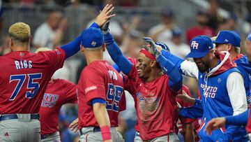 MIAMI, FLORIDA - MARCH 15: Francisco Lindor #12 of Puerto Rico celebrates with teammates after he scored during the fifth inning of the World Baseball Classic Pool D game against the Dominican Republic at loanDepot park on March 15, 2023 in Miami, Florida. Eric Espada/Getty Images/AFP (Photo by Eric Espada / GETTY IMAGES NORTH AMERICA / Getty Images via AFP)