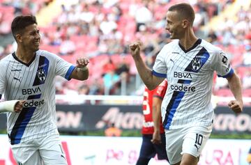 Monterrey's Sergio Canales (R) celebrates after scoring against Guadalajara during the Mexican Apertura tournament football match at the Akron stadium in Guadalajara, Jalisco state, Mexico on September 3, 2023. (Photo by ULISES RUIZ / AFP)