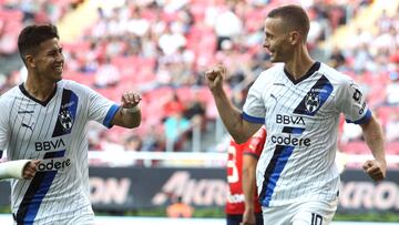 Monterrey's Sergio Canales (R) celebrates after scoring against Guadalajara during the Mexican Apertura tournament football match at the Akron stadium in Guadalajara, Jalisco state, Mexico on September 3, 2023. (Photo by ULISES RUIZ / AFP)