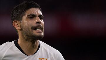Sevilla's Argentinian midfielder Ever Banega reacts during the Spanish league football match between Sevilla FC and Villarreal CF at the Ramon Sanchez Pizjuan stadium in Seville on December 15, 2019. (Photo by JORGE GUERRERO / AFP)
