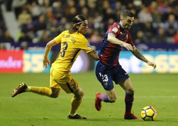 Filipe Luis looks to stop Jason in his tracks.