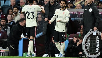 Liverpool's Colombian midfielder Luis Diaz (L) leaves the pitch after being substituted off for Liverpool's Egyptian midfielder Mohamed Salah (R) during the English Premier League football match between Aston Villa and Liverpool at Villa Park in Birmingham, central England on May 10, 2022. (Photo by Paul ELLIS / AFP) / RESTRICTED TO EDITORIAL USE. No use with unauthorized audio, video, data, fixture lists, club/league logos or 'live' services. Online in-match use limited to 120 images. An additional 40 images may be used in extra time. No video emulation. Social media in-match use limited to 120 images. An additional 40 images may be used in extra time. No use in betting publications, games or single club/league/player publications. / 