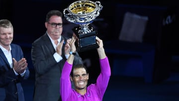 Spain&#039;s Rafael Nadal holds the trophy after winning against Russia&#039;s Daniil Medvedev in their men&#039;s singles final match on day fourteen of the Australian Open tennis tournament in Melbourne early on January 31, 2022. (Photo by William WEST 