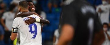 Karim Benzema celebrates scoring Real Madrid's fifth goal with Vinicius Junior on Sunday.