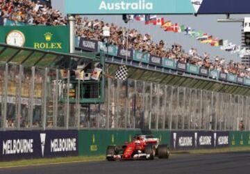 Sebastian Vettel takes the chequered flag.