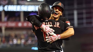 Oct 20, 2023; Phoenix, Arizona, USA; Arizona Diamondbacks center fielder Alek Thomas (5) celebrates with left fielder Lourdes Gurriel Jr. (12) after hitting a two run home run during the eighth inning against the Philadelphia Phillies in game four of the NLCS for the 2023 MLB playoffs at Chase Field. Mandatory Credit: Mark J. Rebilas-USA TODAY Sports