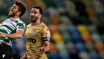 Sporting's Portuguese forward Paulinho (L) heads the ball with BoavistaxD5s French defender Adil Rami (R) during the Portuguese League football match between Sporting Portugal and Boavista at the Jose Alvalade stadium in Lisbon on May 11, 2021. (Phot