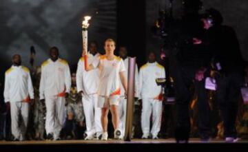 The Pan American Games Torch arrives during the opening ceremony for the 2015 Pan American Games at the Rogers Centre in Toronto, Ontario, on July 10, 2015. AFP PHOTO/HECTOR RETAMAL