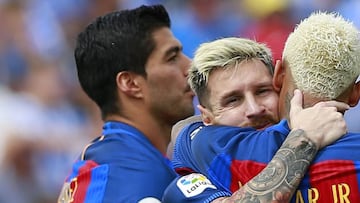 LEGANES, SPAIN - SEPTEMBER 17: Lionel Messi (L) celebrates scoring their fourth goal with teammates Neymar JR. (R) and Luis Suarez (L) during the La Liga match between Deportivo Leganes and FC Barcelona at Estadio Municipal de Butarque on September 17, 20