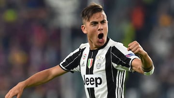 (FILES) This file photo taken on April 11, 2017 shows Juventus&#039; forward from Argentina Paulo Dybala celebrating after scoring during the UEFA Champions League quarter final first leg football match Juventus vs Barcelona, on April 11, 2017 at the Juventus stadium in Turin. Dybala has extended his contract with Juventus Turin with which he is now linked until 2022, announced on April 13, 2017 the Italian club. / AFP PHOTO / GIUSEPPE CACACE