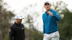 Sep 8, 2018; Newtown Square, PA, USA; Justin Rose reacts in front of Xander Schauffele after making par on the 14th hole during the third round of the BMW Championship golf tournament at Aronimink GC. Mandatory Credit: Bill Streicher-USA TODAY Sports