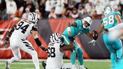 CINCINNATI, OHIO - SEPTEMBER 29: Quarterback Tua Tagovailoa #1 of the Miami Dolphins is sacked by defensive tackle Josh Tupou #68 of the Cincinnati Bengals during the 2nd quarter of the game against the Cincinnati Bengals at Paycor Stadium on September 29, 2022 in Cincinnati, Ohio.   Andy Lyons/Getty Images/AFP