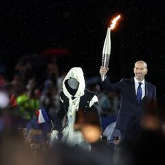 Who was the mystery masked torch bearer at the Paris 2024 Olympic Games opening ceremony?