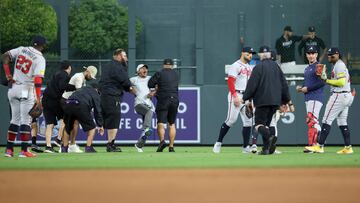 DENVER, COLORADO - AUGUST 28: A fan yells to Ronald Acuna Jr. #13 of the Atlanta Braves after running on the field and being apprehended by security during the game between the Colorado Rockies and the Atlanta Braves at Coors Field on August 28, 2023 in Denver, Colorado. Tyler Schank/Clarkson Creative/Getty Images/AFP (Photo by Tyler Schank/Clarkson Creative / GETTY IMAGES NORTH AMERICA / Getty Images via AFP)