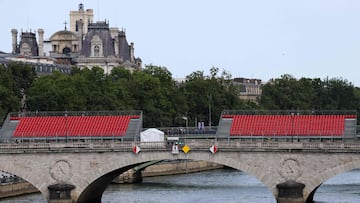 An inflatable vessel passes along the River Seine in Paris on July 18, 2024, in front of stands set up for spectators ahead of the opening ceremony of the Paris 2024 Olympic Games. (Photo by EMMANUEL DUNAND / AFP)
