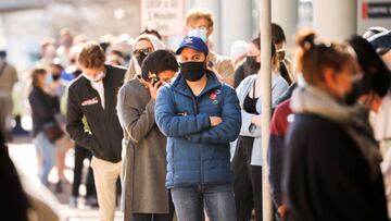 FILE PHOTO: People queue outside a coronavirus disease (COVID-19) vaccination centre as the country opens vaccinations for everyone 18 years old and above in Cape Town, South Africa, August 20, 2021. REUTERS/Mike Hutchings/File Photo